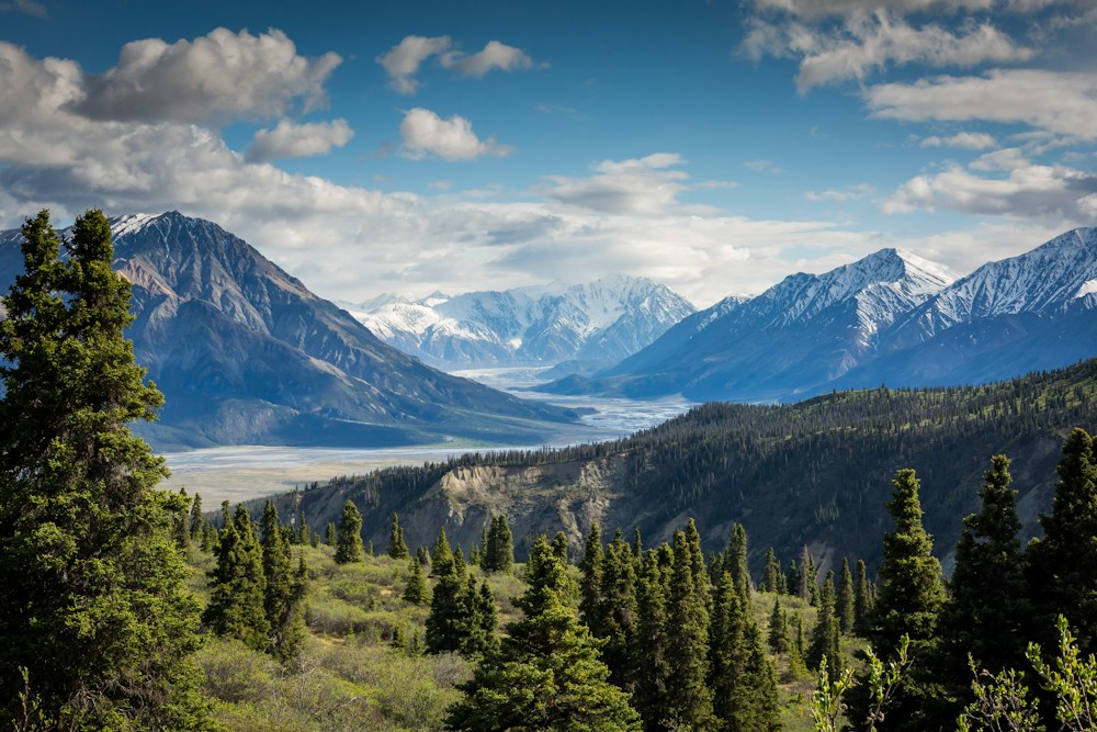 Dramatic mountain peaks beneath a bright sky